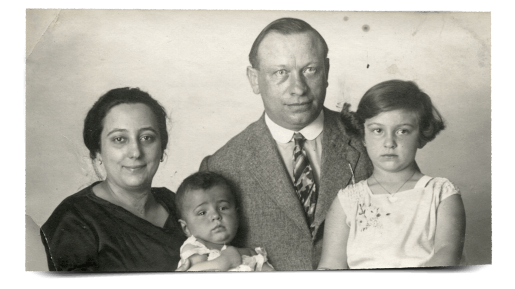 Formal family portrait of mother, father, Tomy and Iby in 1929